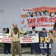 Фото 24-kg.com. Pay up! — один из частых лозунгов на акциях экоактивистов во время COP29